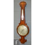 A 19th Century mahogany wheel barometer of scroll outline,