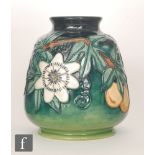 A Moorcroft Pottery vase decorated in the Passion Fruit pattern designed by Rachel Bishop,