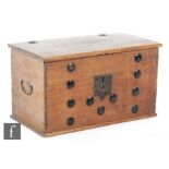 A small Eastern elm blanket chest mounted with lozenge bosses and engraved lock plate to the front,