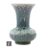 Ruskin Pottery - A miniature high fired vase of globe and shaft form decorated in an all over