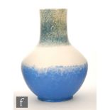 Ruskin Pottery - A crystalline glaze vase of angular form with a cylinder neck decorated in a