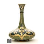 William Moorcroft - James Macintyre & Co - A Florian Ware vase of compressed globe and shaft form