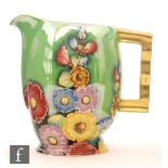 Carlton Ware - A 1930s Art Deco Moderne shape jug decorated in the gilt and enamel Hollyhocks