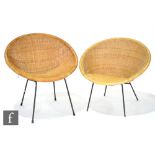 Unknown - A pair of woven wicker tub shaped chairs raised to steel frames.