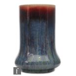 Ruskin Pottery - A high fired 'Elephants Foot' vase decorated in a sang de boeuf glaze with deep