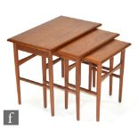 Kai Kristiansen - A nest of three teak occasional tables of rectangular form on tapered legs,