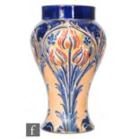 William Moorcroft - James Macintyre & Co - An Alhambra Ware vase of inverted form decorated with