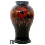 William Moorcroft - A large vase of inverted baluster form decorated in the Pomegranate pattern