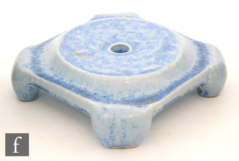 Ruskin Pottery - A crystalline glaze stand of square form raised to four scroll feet,