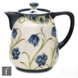 William Moorcroft - James Macintyre & Co - A tea for two teapot decorated in the Harebells pattern,