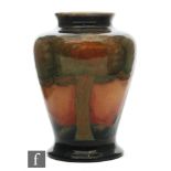 William Moorcroft - A small vase of inverted baluster form decorated in the Eventide pattern with