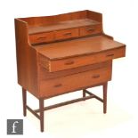 Unknown - A teak ply writing desk, with shelf over pull-out writing surface and fitted drawers,