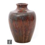 Pierrefonds - An early 20th Century high fired stoneware vase decorated in an all over red glaze