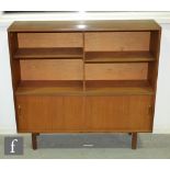 Robert Heritage - Beaver & Tapley - A 1960 teak and glass book case with twin glazed doors above