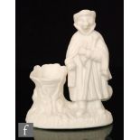 A 19th Century Parian spill vase formed as a wolf dressed in a cloak and hat holding a staff on an