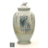 A later 20th Century Poole Pottery vase of footed ovoid form,