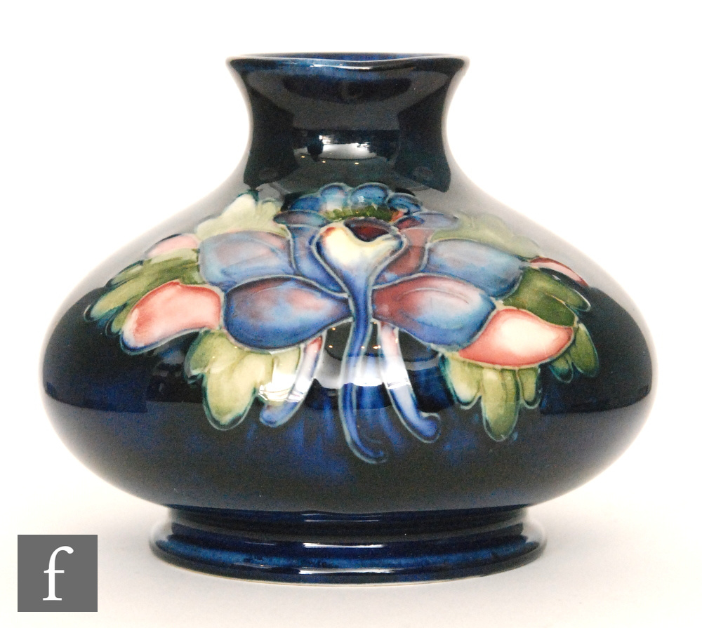 A small post war Moorcroft pottery vase of compressed ovoid form with everted neck decorated in the