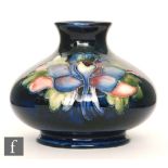 A small post war Moorcroft pottery vase of compressed ovoid form with everted neck decorated in the