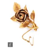 An 18ct hallmarked floral spray brooch modelled as a rose, length 5.5cm, weight 12.