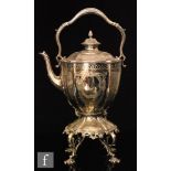 A 19th Century silver plated spirit kettle of circular panelled from with foliate engraved