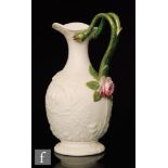 A mid 19th Century Parian jug, attributed to Samuel Alcock decorated to the body with cast roses,