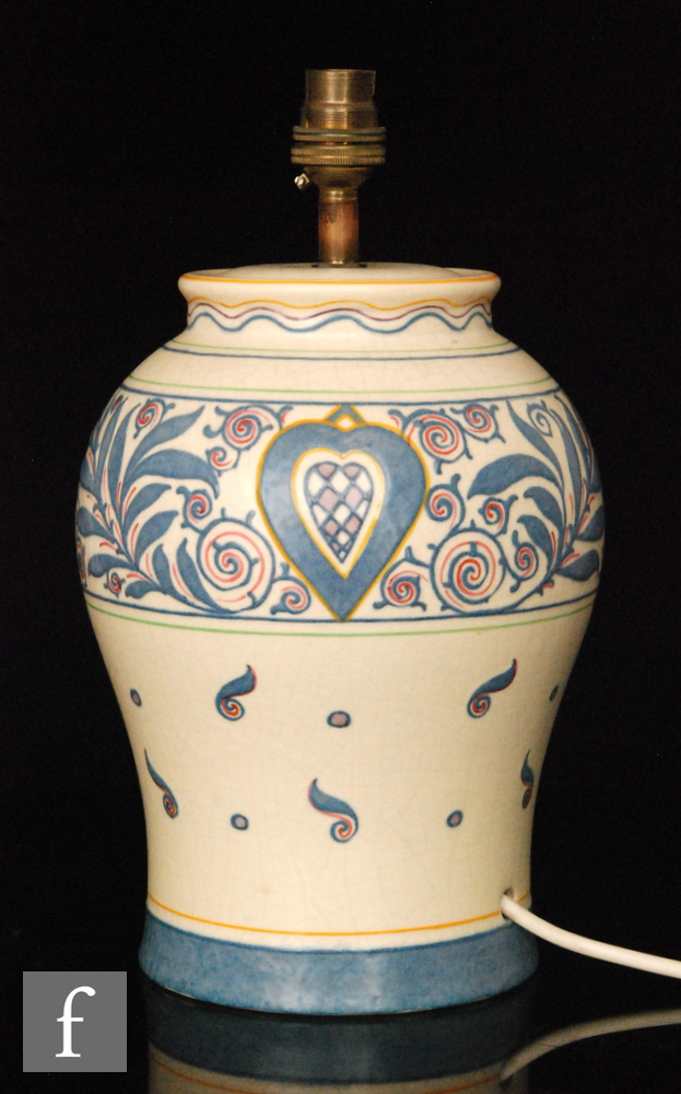 A Bursley Ware table lamp base designed by Charlotte Rhead decorated with scrolls,