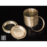 A set of six Sterling silver mounted circular glass coasters each with shallow pierced gallery,