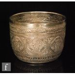A Victorian hallmarked silver circular sugar basin with Indian style chased decoration to whole,
