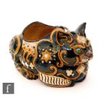An early 20th Century majolica type jardiniere modelled as a seated oriental cat,