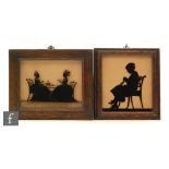 MANNER OF WILLIAM WELLINGS - Two ladies sitting at a table, silhouette reverse painted on glass,