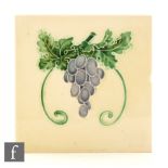 A group of three assorted Art Nouveau tiles with floral and fruit designs,