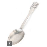 A hallmarked silver Arts and Crafts spoon with planished bowl below plain stem below pierced