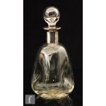 An early 20th Century hallmarked silver collared glass decanter,