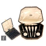 An Art Deco hallmarked silver eight piece manicure set with engine turned decoration,