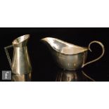 A hallmarked silver small jug of plain form terminating in angular handle height 8cm,