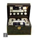 A 19th Century brass bound coromandel vanity box opening to fitted interior with ten clear glass