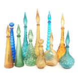 A group of eleven Continental novelty glass decanters of various form and moulded decoration,