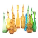 A group of twelve Continental novelty glass decanters of various form and moulded decoration,