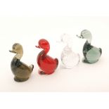 A group of four later 20th Century Whitefriars glass stylised duck figures with internal controlled