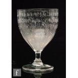 A late 18th Century drinking glass with a tapered ovoid bowl with basal petal moulding,