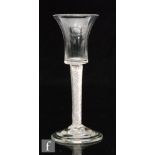 An 18th Century drinking glass circa 1750, flared bucket bowl above a multi series air twist stem,