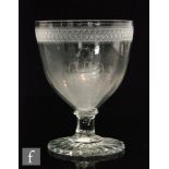 An early 19th Century oversized Rummer with an ovoid bowl with upper engraved diamond band above a