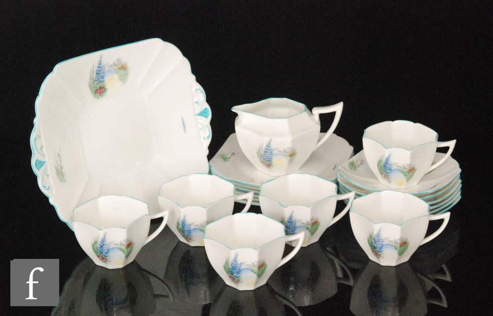 A 1930s Shelley Queen Anne shape part teaset comprising one milk jug, six cups,