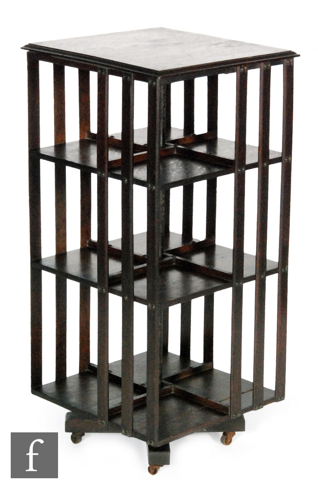 An early 20th Century oak three tier square revolving bookcase,