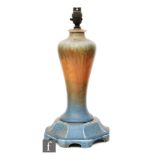 A Ruskin Pottery crystalline glaze lamp base affixed to a pedestal stand,