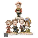 A collection of three 19th Century Derby grotesque dwarf figures,