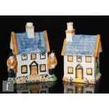 Two Staffordshire early 19th Century Prattware cottage money boxes, each of typical form,