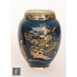 A 1930s Carlton Ware Art Deco vase decorated in the Dragon and Traveller pattern with a gilt and