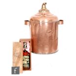 A copper cylindrical whisky still,