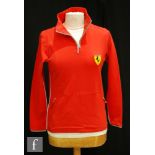 A collection of ladies Ferrari licensed products to include a track side jacket, t-shirts,